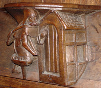 Haut relief : mendiant à la jambe de bois